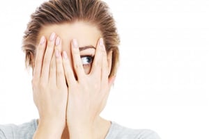 woman hiding her face